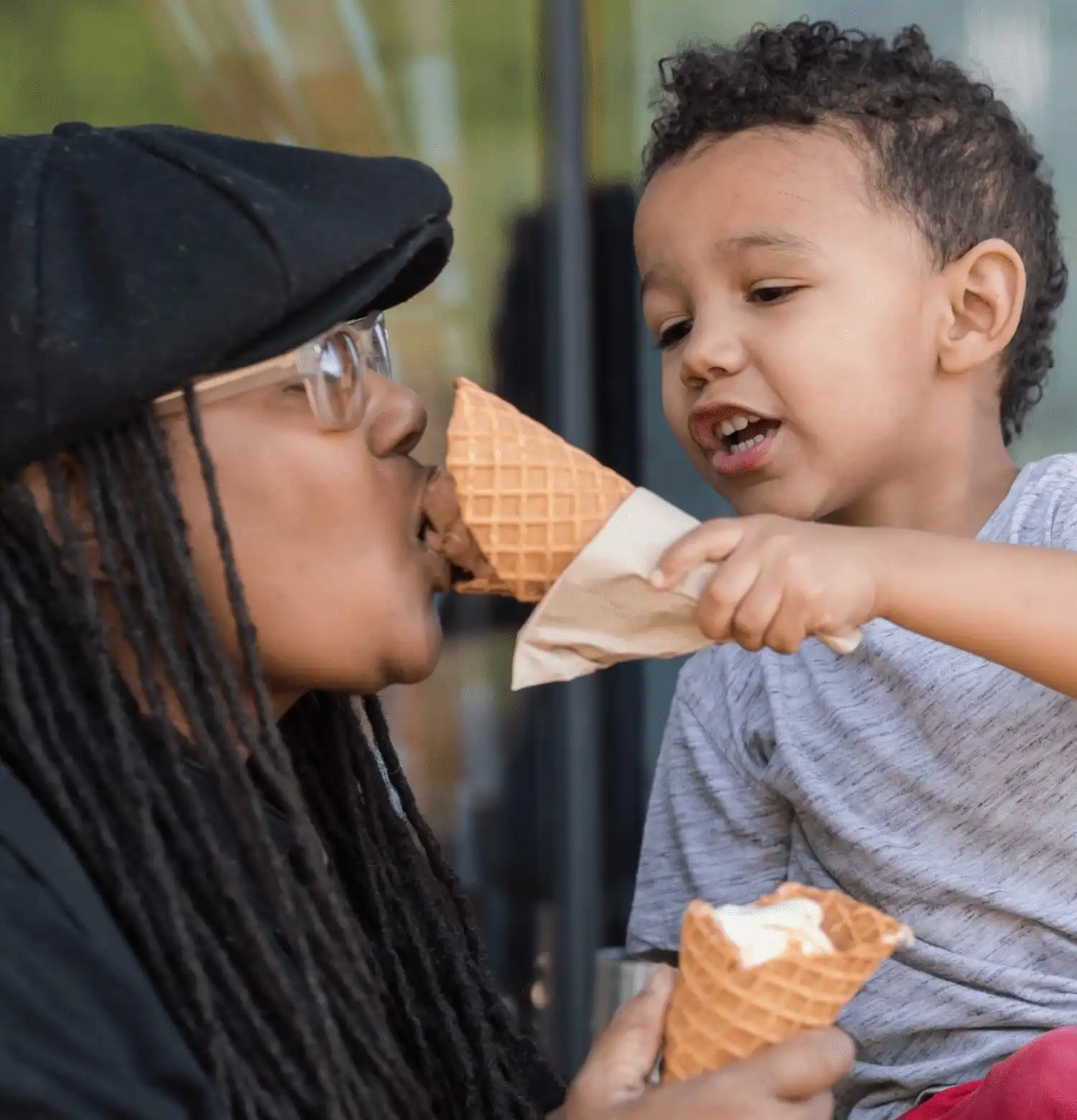 Child feeding mom ice cream