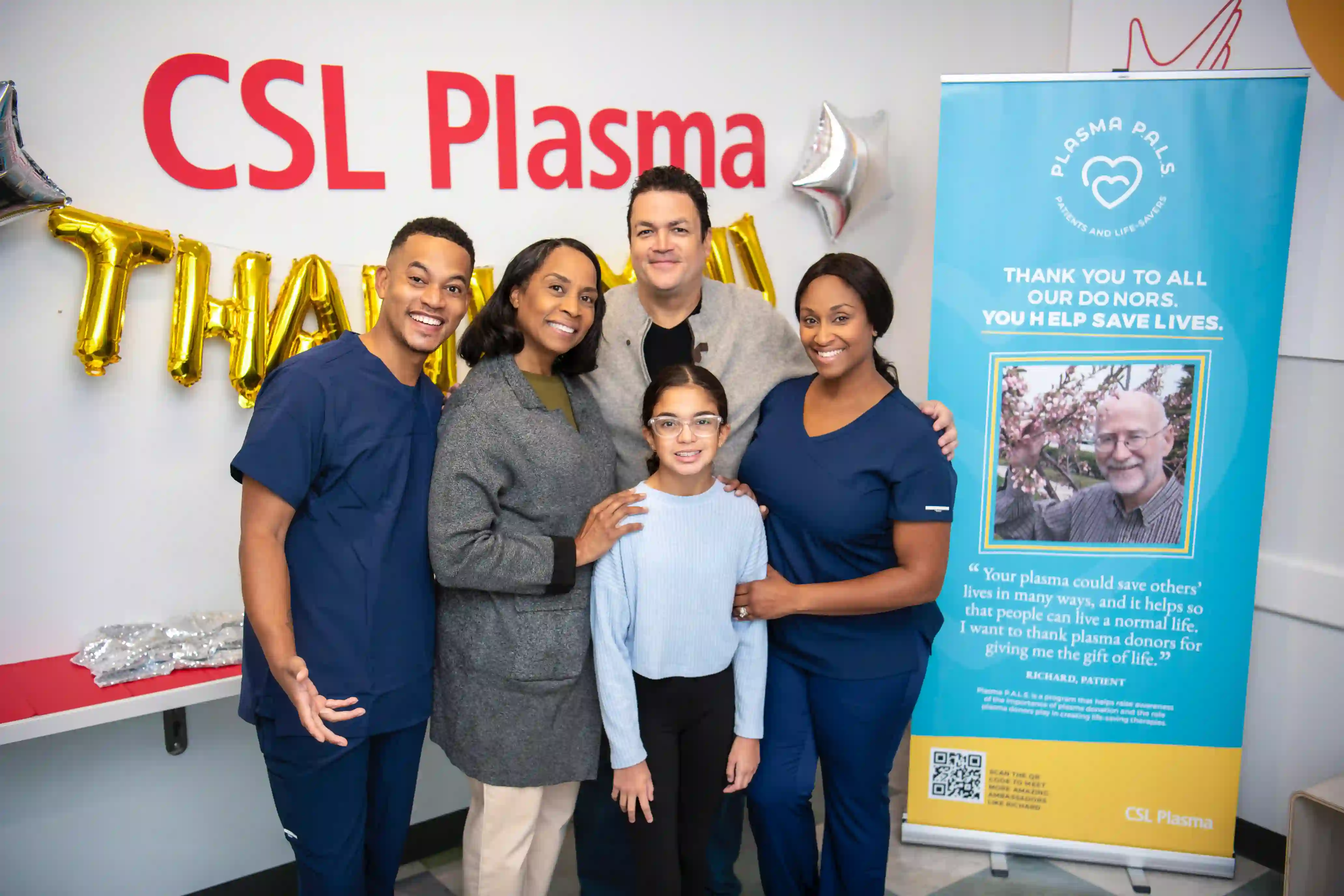 CSL Plasma employees with a plasma patient