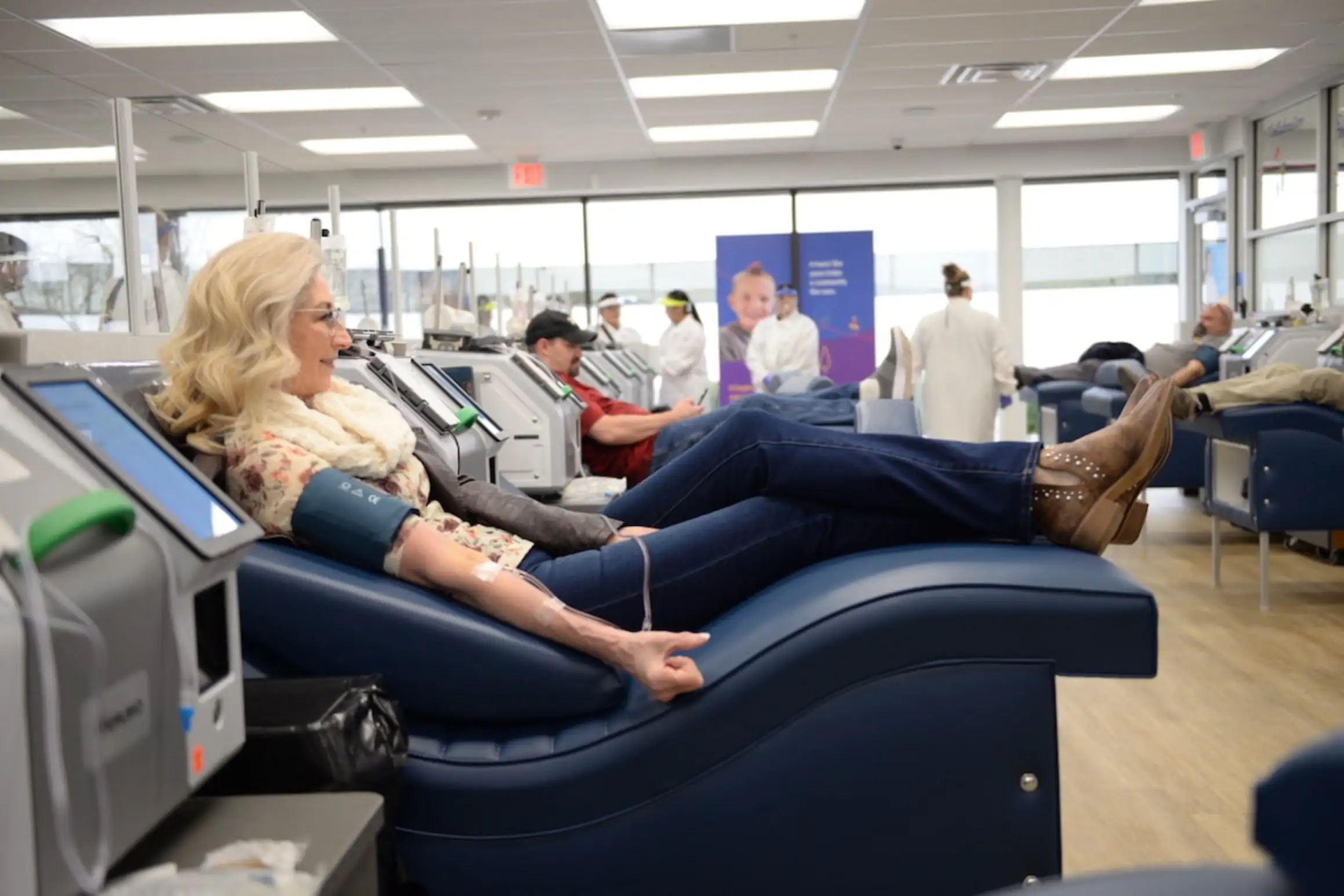 Older woman donating plasma