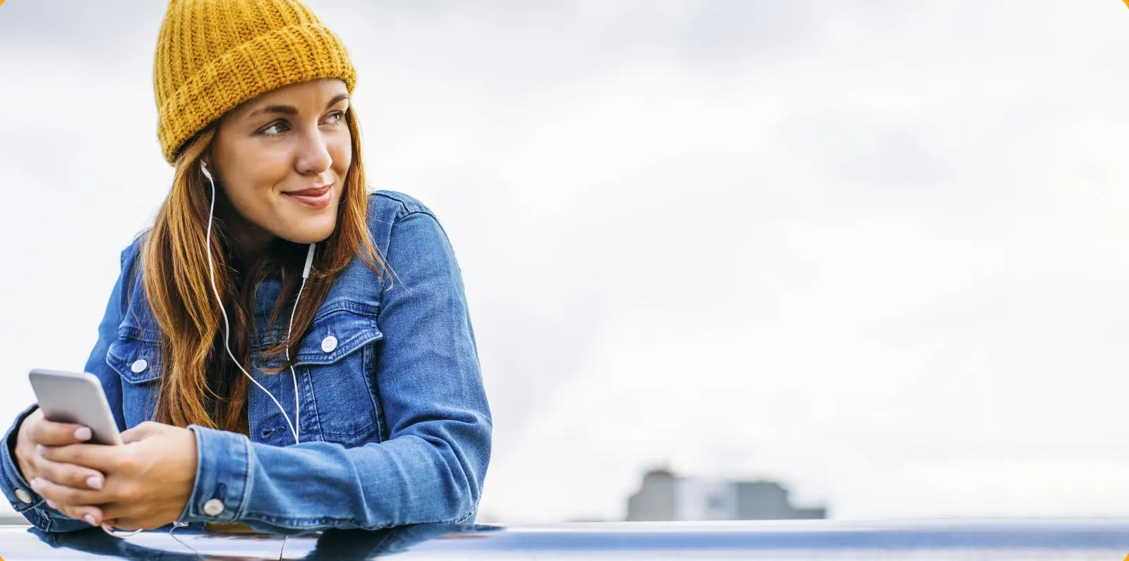 a young adult female with mobile phone